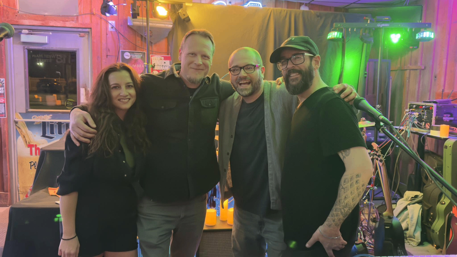 Penumbra group photo backstage at a venue